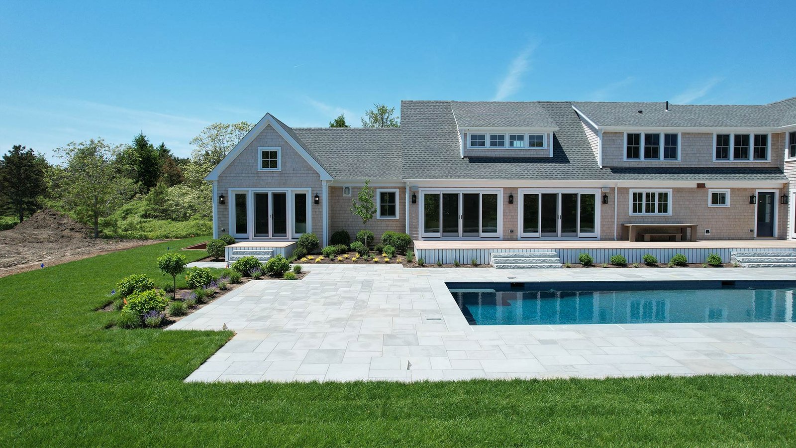 Completed bluestone pool surround and landscape planting at West Tisbury estate, Martha's Vineyard — LandMasters