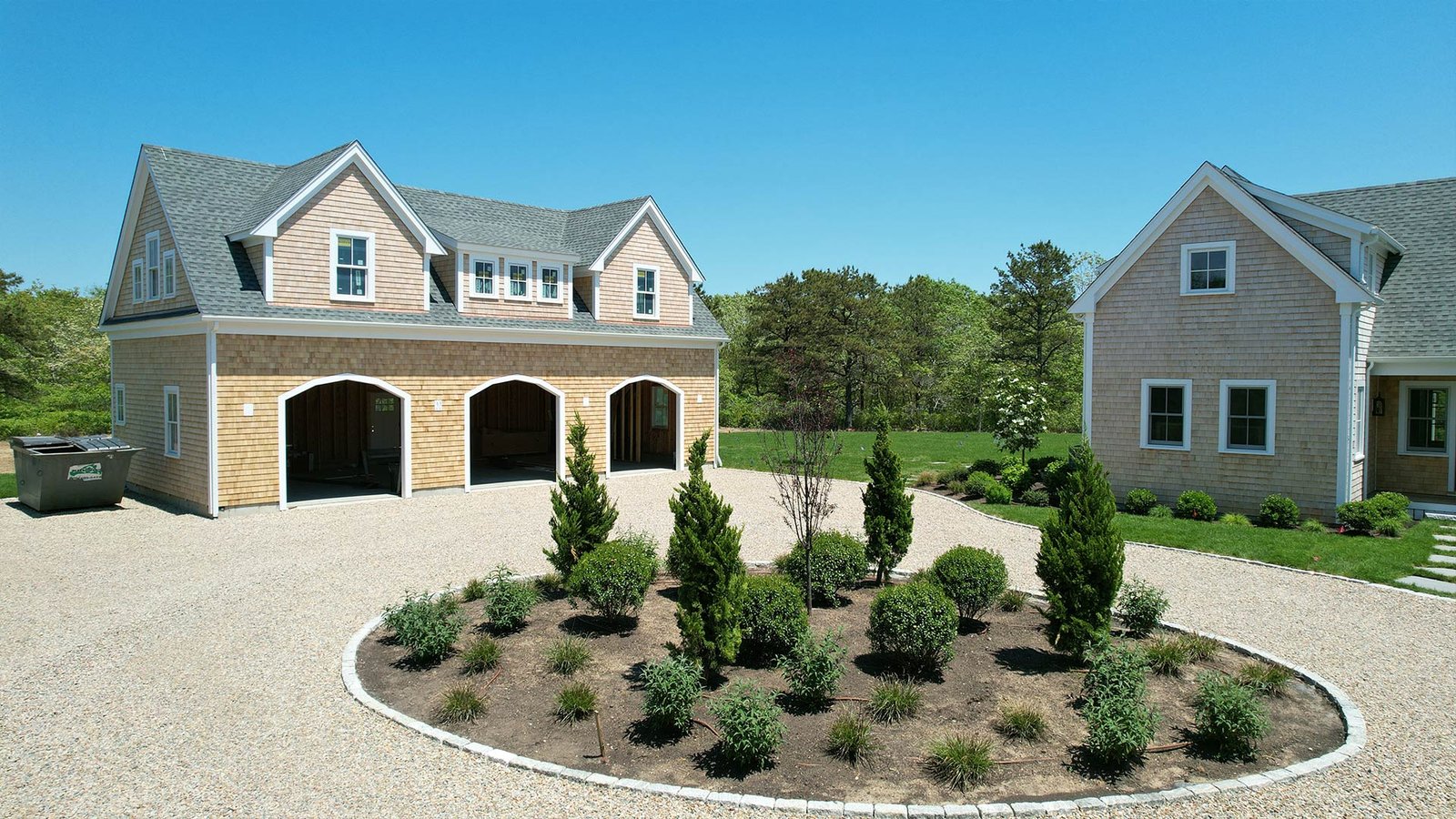 Circular gravel motor court with central island planting — juniper and boxwood, West Tisbury Martha's Vineyard