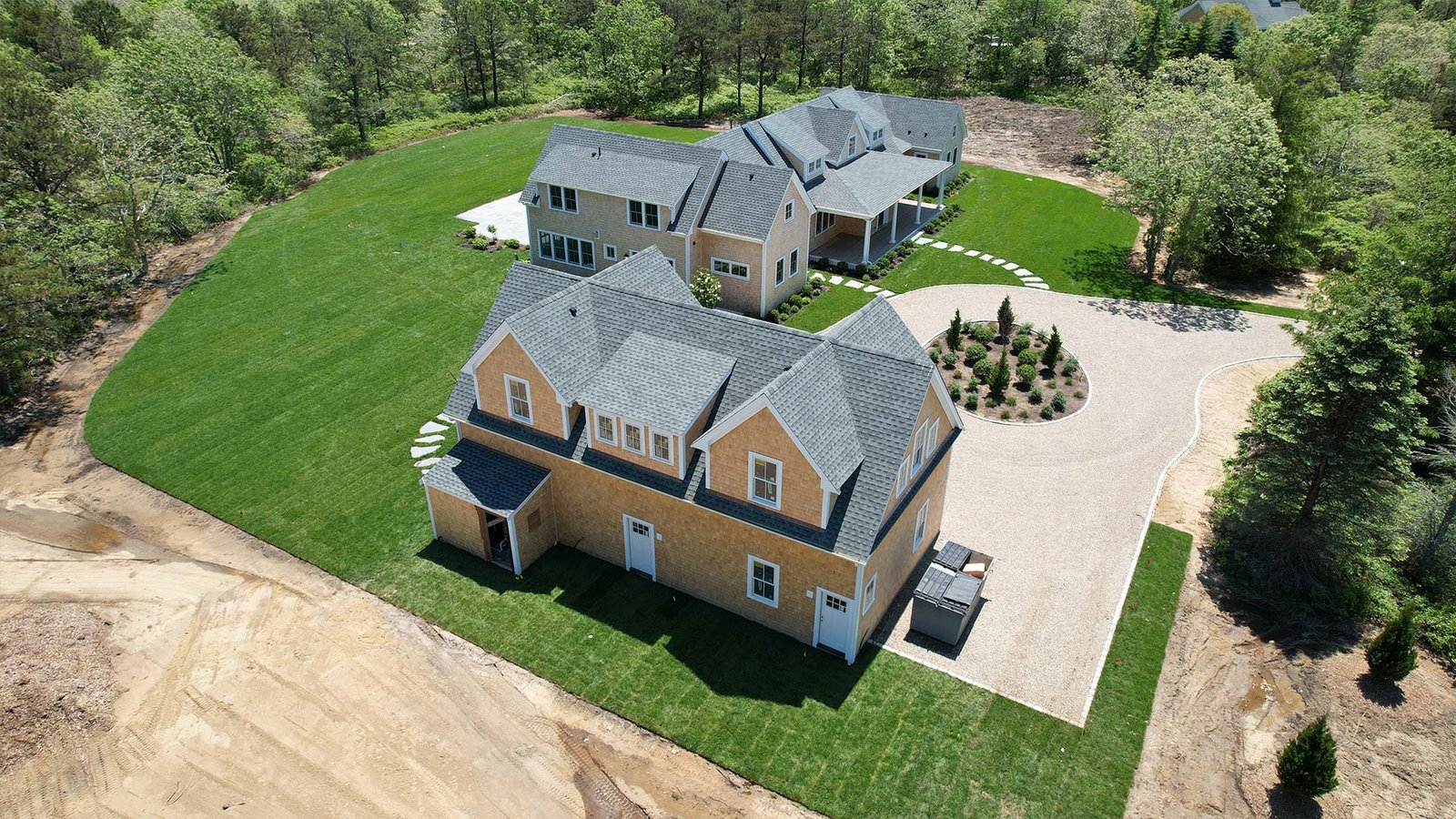Foundation planting boxwood border along covered porch, West Tisbury estate Martha's Vineyard