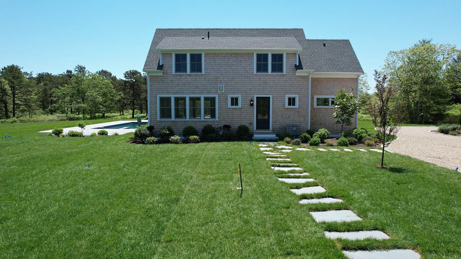 Pool surround bluestone detail and planting beds West Tisbury estate LandMasters MV