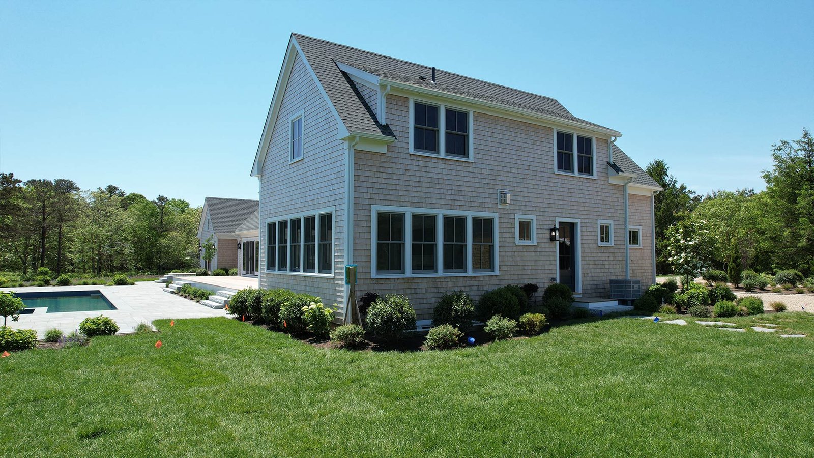 Aerial oblique showing ipe deck, bluestone pool surround and stepping stone path — West Tisbury Martha's Vineyard